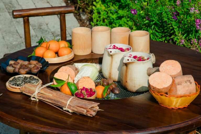 A healthy Mediterranean meal with grilled salmon, fresh salad, and quinoa on a wooden table.